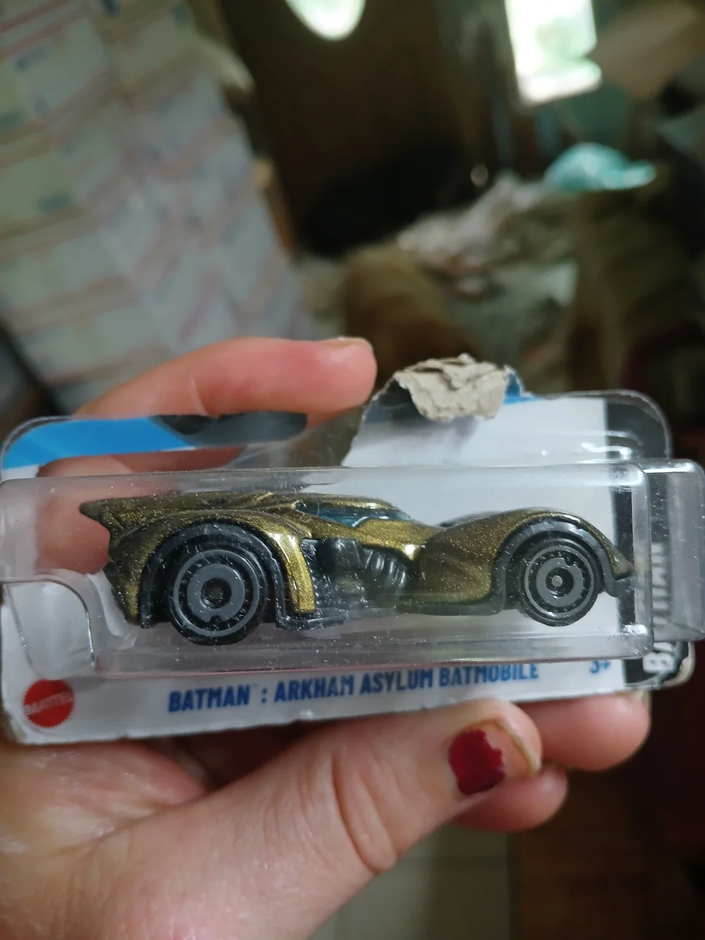 Hot Wheels Batman: Arkham Asylum Batmobile (specifically the gold/bronze variant